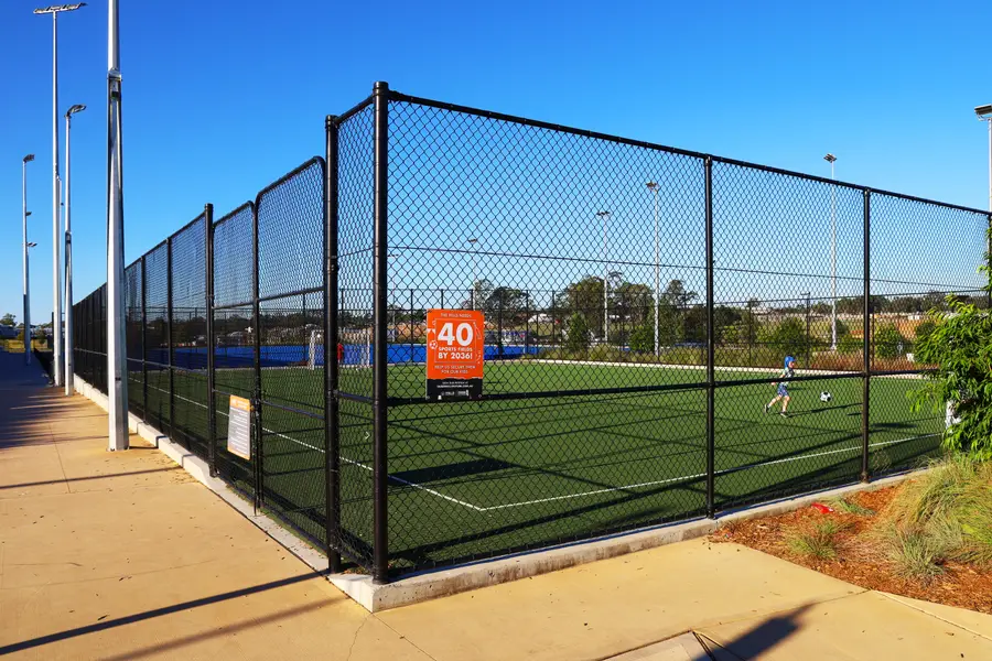 Fully enclosed cage, fabricated to the court