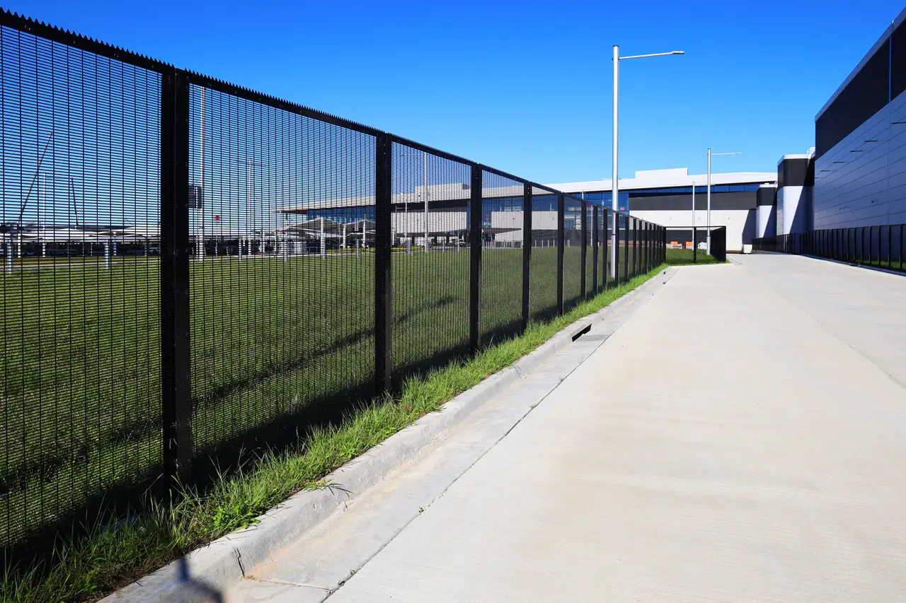 Anti-climb boundary and sliding gates for a logistics yard